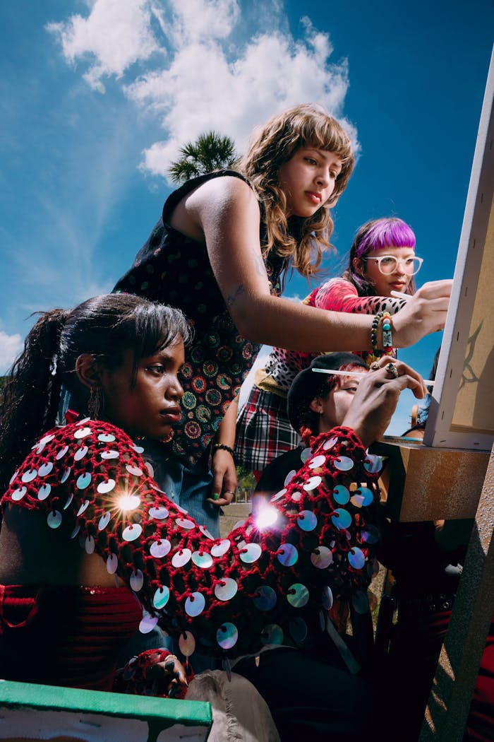 Group of Girls Painting on Canvas